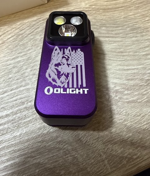 Purple Olight Oclip engraved with a German Shepherd portrait blended into a distressed American flag