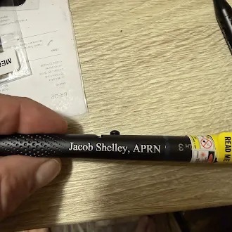 Black pen laser engraved with Jacob Shelley, APRN
